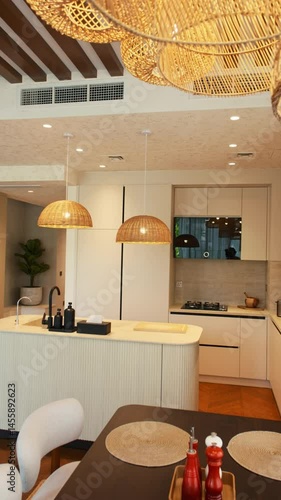 A chic kitchen in an expensive private villa in Dubai, illuminated by sunlight from huge windows