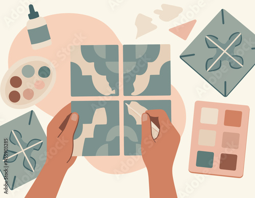 hands crafting colorful mosaic tiles