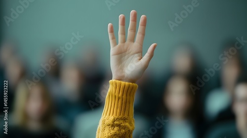 A raised hand signals a question during a presentation.
