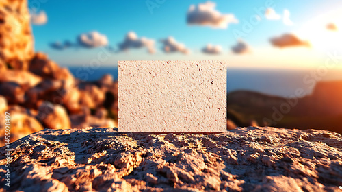 Blank Card Mockup on Concrete Step with Ocean Sunset View photo