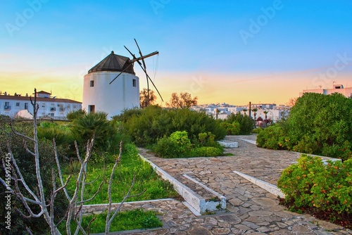 Vejer de la Frontera, ruin of an old wind mill within sunset. Cadiz province, Andalusia, Spain
