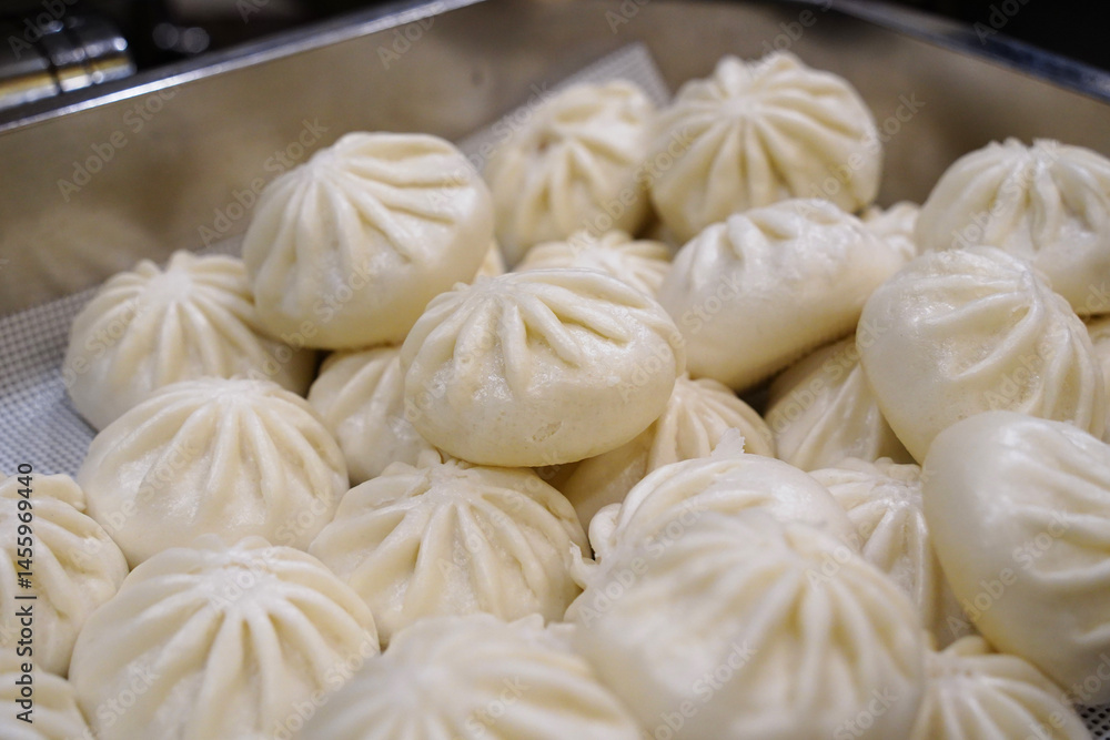 Pile of freshly steamed baozi buns ready to eat Pile of freshly steamed baozi buns ready to eat