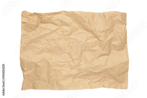 Crumpled piece of beige parchment or baking paper isolated on white background. Copy space for text and design element.