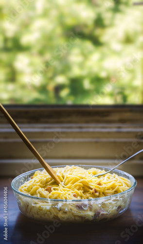 Close-up of Creamy Spaghetti Carbonara with Bacon and Herbs - vertical