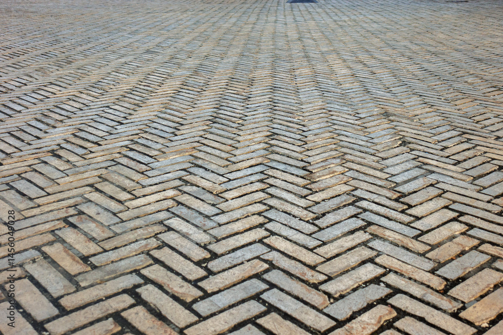 Fototapeta premium The art and charm of historic brickwork that showcases meticulous pattern in a durable walkway