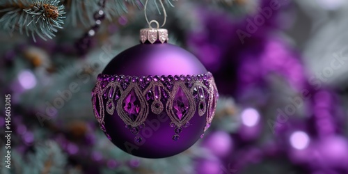 Obraz na płótnie A purple ornament hanging from a tree. The ornament is decorated with beads and has a gold trim w salonie