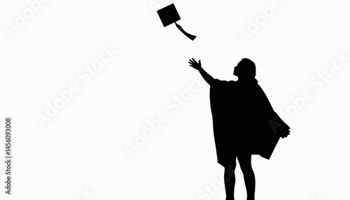 Silhouette of a person celebrating graduation by throwing a cap, accomplishment