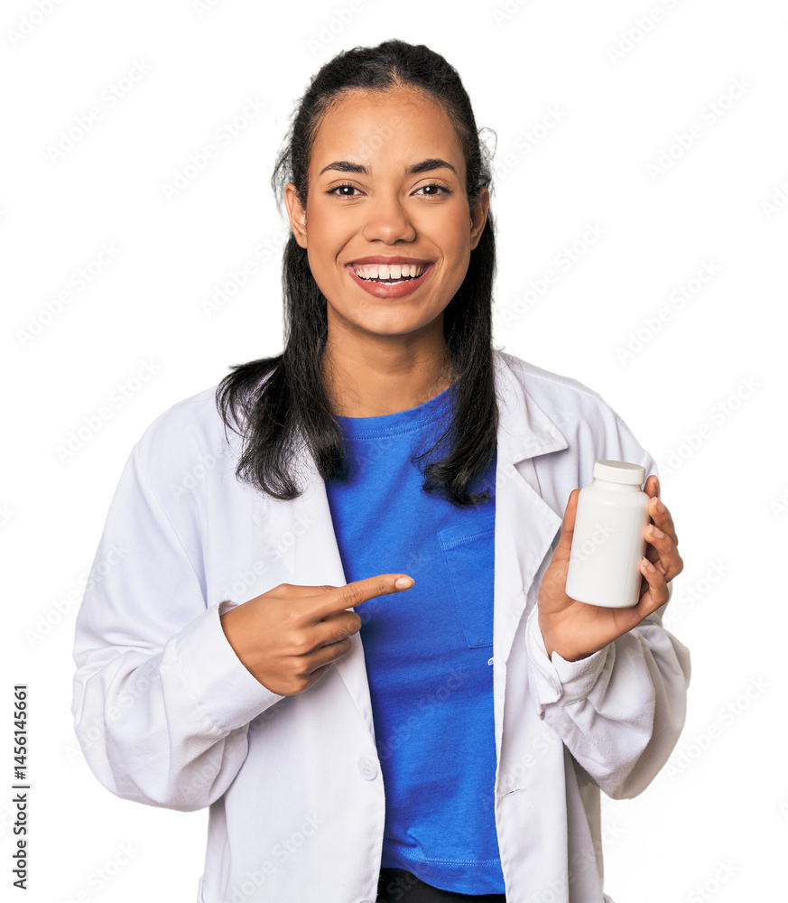 Young Filipina pharmacist with pills smiling and pointing aside, showing something at blank space. Young Filipina pharmacist with pills smiling and pointing aside, showing something at blank space.