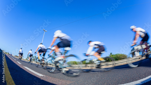 Cycling Riders Road Race Motion Speed Blur Close-up Blue Sky.