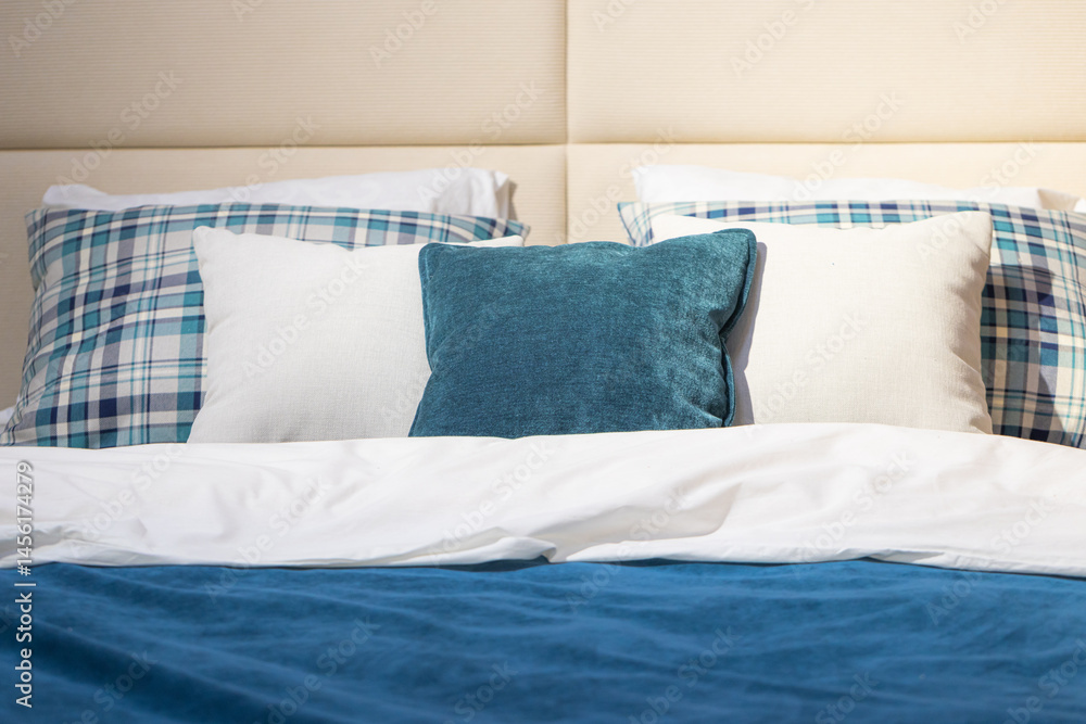Closeup of cushions on bed