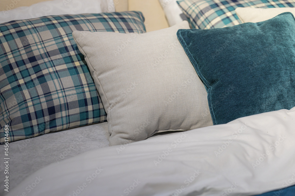 Closeup of cushions on bed