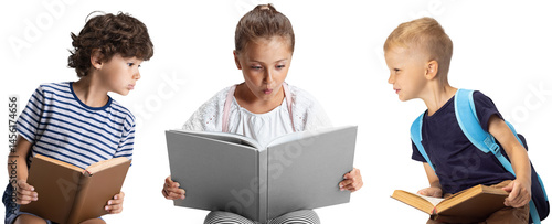 Obraz na płótnie Three children sitting and reading big book together, showing concentration and curiosity isolated on transparent background. Concept of childhood, early development w salonie