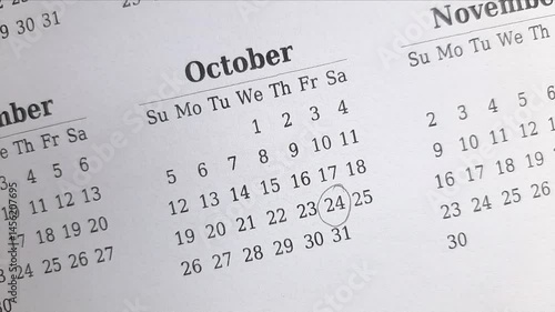 marking 24 October date on the calendar	

