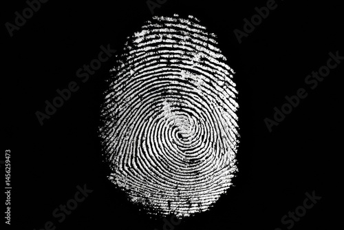Detailed black and white close-up shot of a fingerprint against a stark black background.