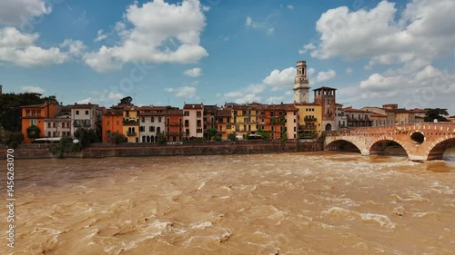 Sunny morning on River Adige in Verona, Veneto, Italy capturing reflections of riverside promenades
