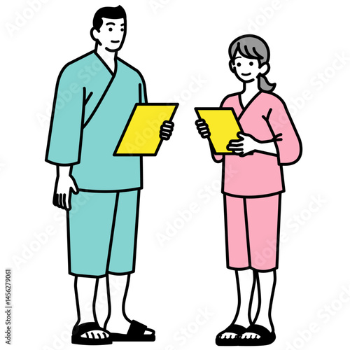 検査着を着て検査リストを見る男女