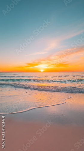 Peaceful sunset over tranquil beach.