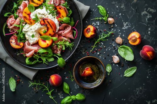 A gourmet breakfast plate with sunny side up eggs, prosciutto, peaches, and fresh greens on a dark slate background.