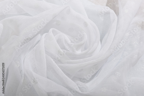 The texture of the white fabric. Wave fabric, textile, cloth, delicate textured material.