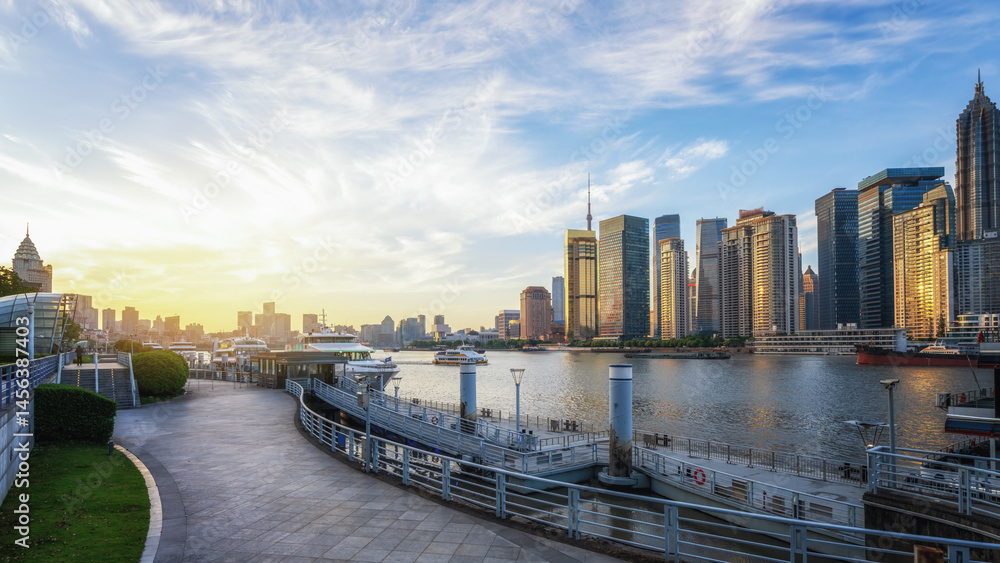 Fototapeta premium Breathtaking Sunset Over a Tranquil Urban Waterfront