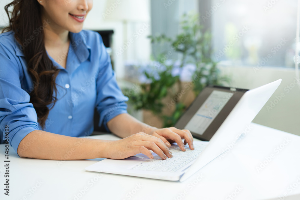 Business woman sitting front tablet ,laptop computer with financial graphs and statistics on monitor. Business woman sitting front tablet ,laptop computer with financial graphs and statistics on monitor.