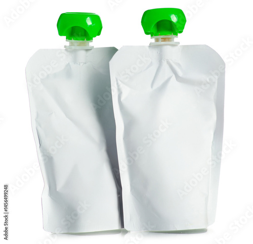 White baby fruit puree in squeeze pouches on white background isolation