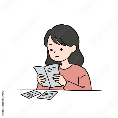 Woman reviewing unpaid bills with a worried expression at desk