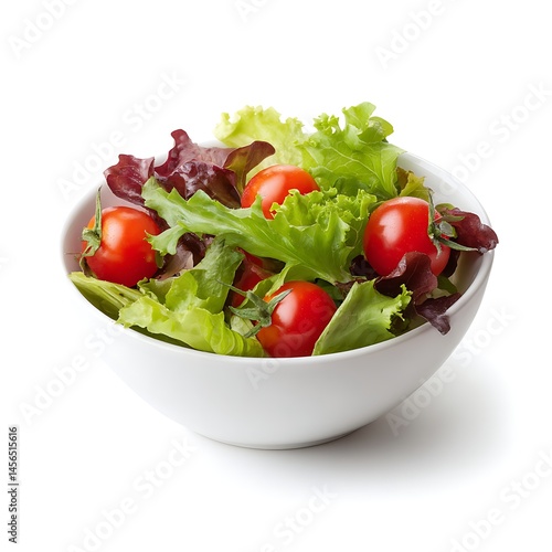 A white bowl filled with a fresh salad of lettuce and cherry tomatoes on a white background view from above