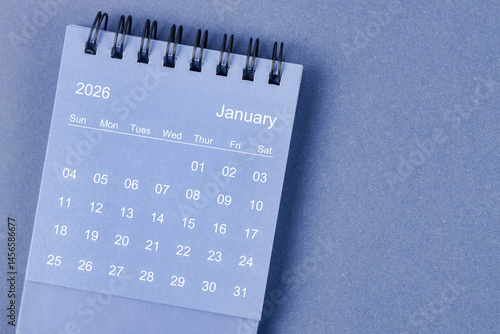 January 2026 Monthly desk calendar for 2026 year on blue background.