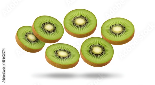 Levitating kiwi slices with realistic green pulp, soft hairy skin edge, and high contrast shadows on white background

