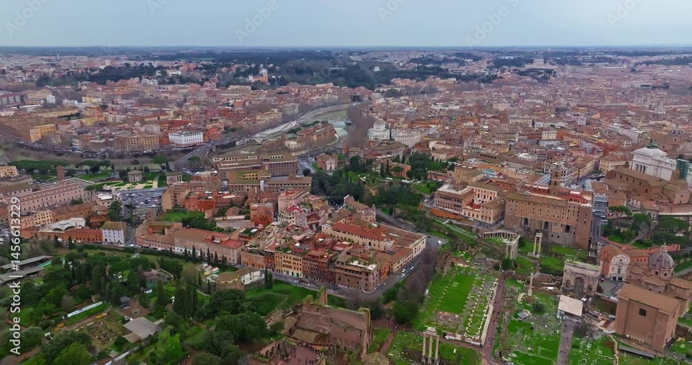 Aerial view rooftops of the city of Rome, Italy. Establishing shot of the capital's skyline. Drone flying over rooftop gardens and old buildings in historic urban borough. Beautiful views of Rome Aerial view rooftops of the city of Rome, Italy. Establishing shot of the capital's skyline. Drone flying over rooftop gardens and old buildings in historic urban borough. Beautiful views of Rome