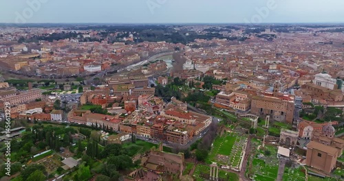 Wallpaper Mural Aerial view rooftops of the city of Rome, Italy. Establishing shot of the capital's skyline. Drone flying over rooftop gardens and old buildings in historic urban borough. Beautiful views of Rome Torontodigital.ca