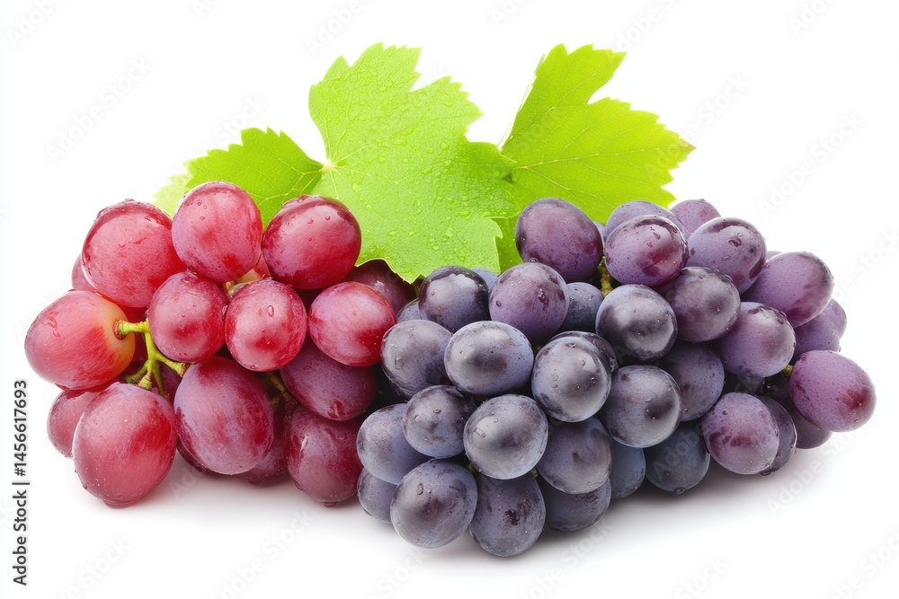 Fototapeta premium Close-up of Two Bunches of Fresh Grapes Red and Purple with Green Leaf on White Background Studio Shot Still Life