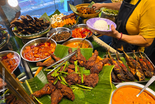 Traditional Malaysian Nasi Lemak Dishes with Assorted Side Dishes