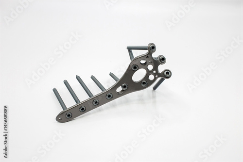 A Proximal Tibial Posterior plate implant with screws, designed for orthopedic use, showcasing precision