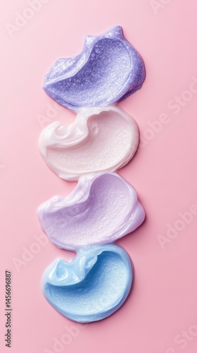 Obraz na płótnie Pastel Swirls of Beauty: A Stacked Collection of Cosmetic Cream on Pink Backdrop, Perfect for Skincare Ads w salonie