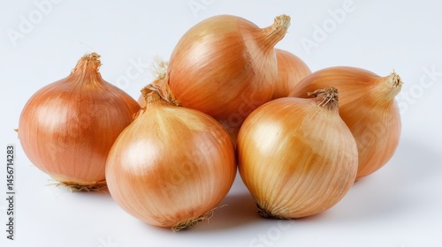 Wallpaper Mural Five whole yellow onions with dry skins are arranged on a white surface. Torontodigital.ca