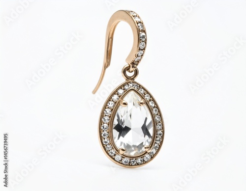Obraz na płótnie Dangle earring with clear teardrop gem encircled by gems, suspended from a curved hook w salonie