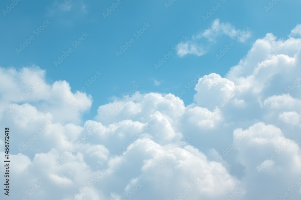 Fluffy white clouds float across a bright blue sky, creating a calm and serene atmosphere.