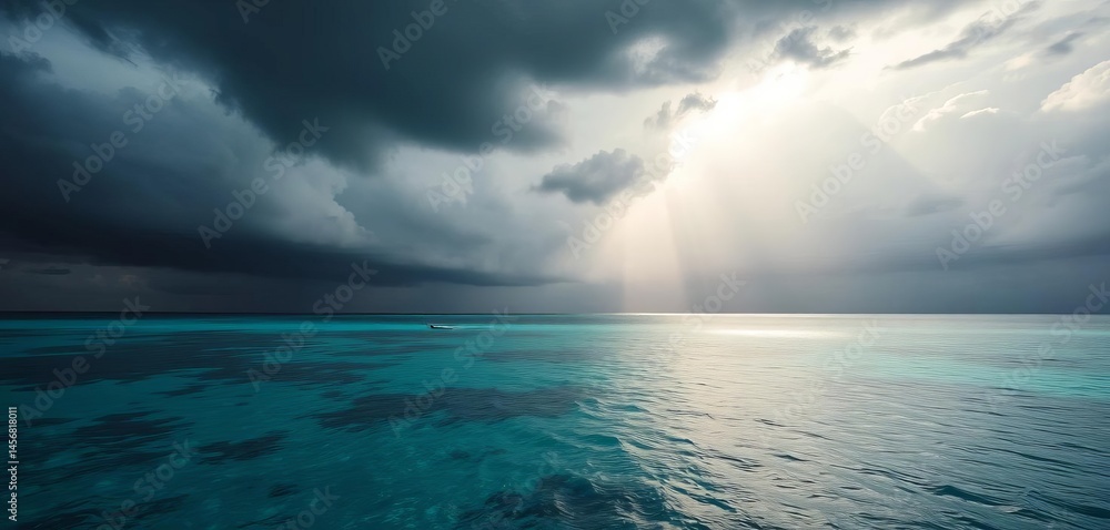 Fototapeta premium Dark, brooding storm clouds unleashing torrential rain over the turquoise waters of the Maldives, waves, cyclone