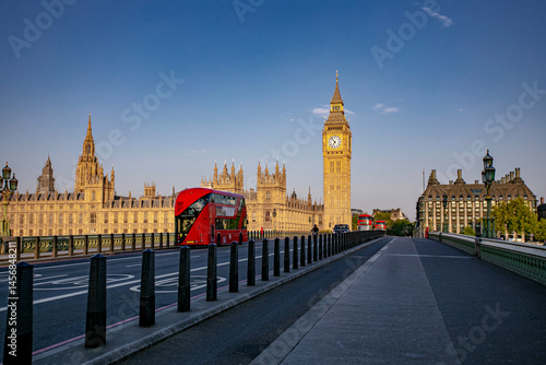 An Iconic London Landscape Showcasing Big Ben Alongside a Classic Red Bus in Action
