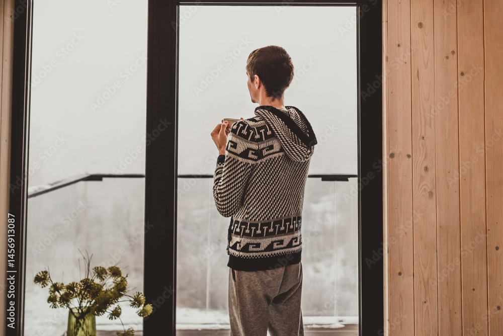 Man Drinking Morning Coffee by Big Window