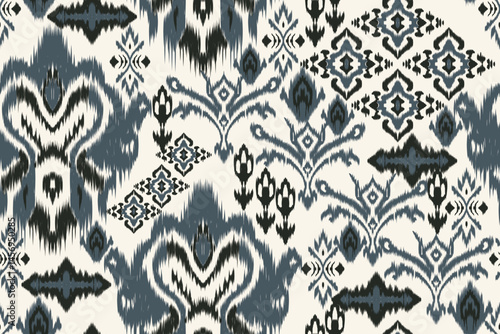 Seamless ikat pattern with floral and geometric motifs in indigo blue and black traditional ethnic textile design for fabric, wallpaper, bohemian decor, fashion prints, and backgrounds.