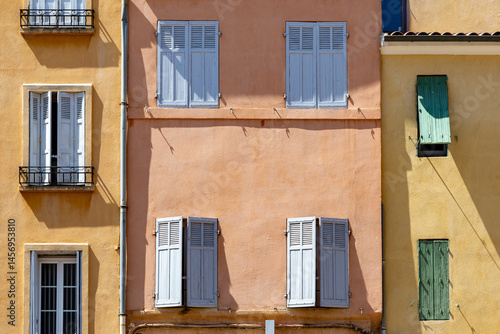 Obraz na płótnie background of colorful old facades with open and closed wooden shutter in Aix en Provence w salonie