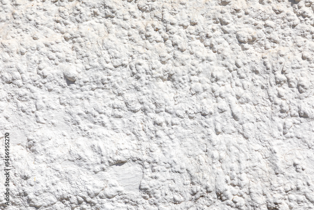 white background of structured plaster wall