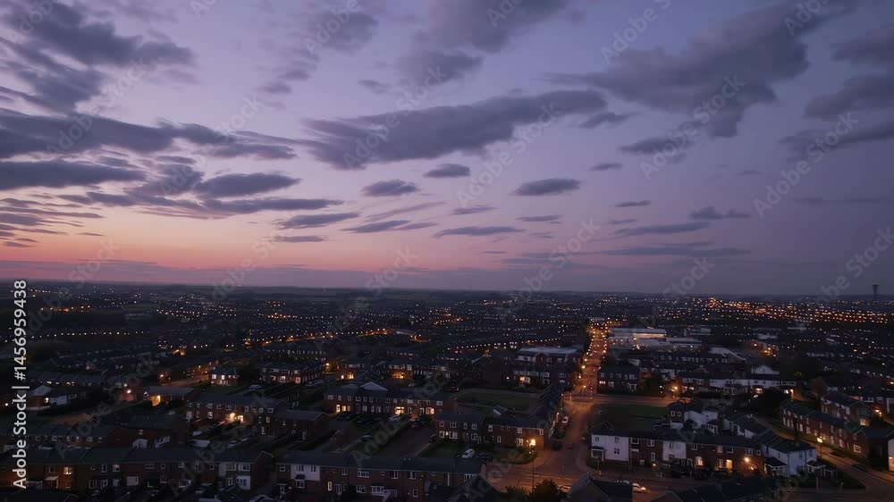 Twilight cityscape: captivating aerial view of sunset over urban landscape with dynamic clouds Twilight cityscape: captivating aerial view of sunset over urban landscape with dynamic clouds