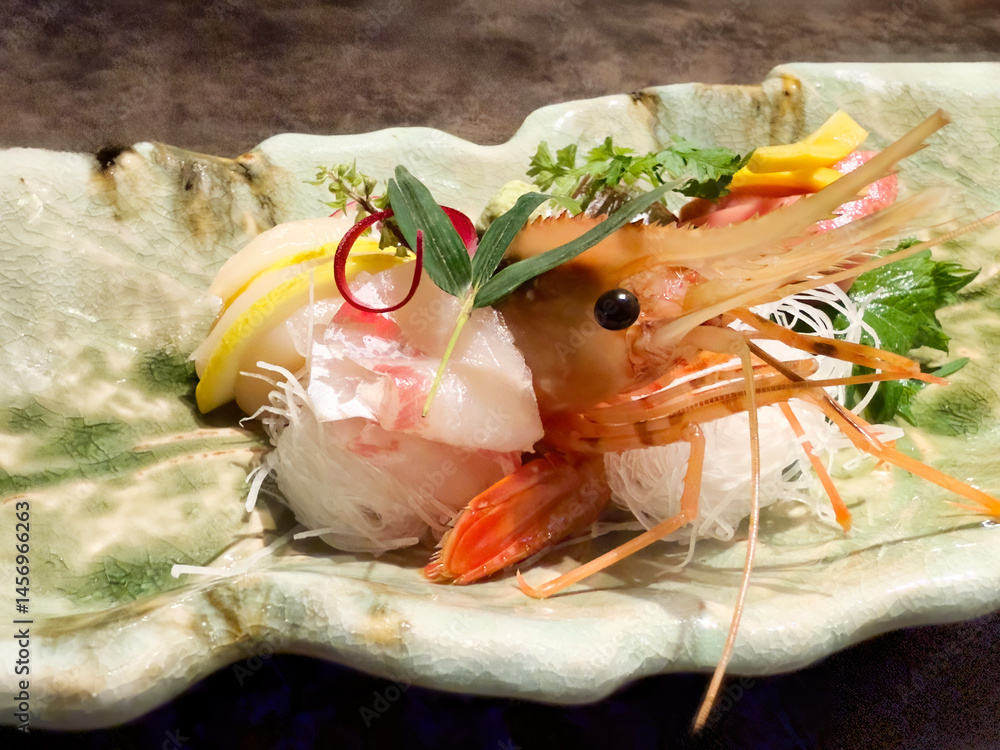 Large shrimp served in a fine plate with various raw garnishes
