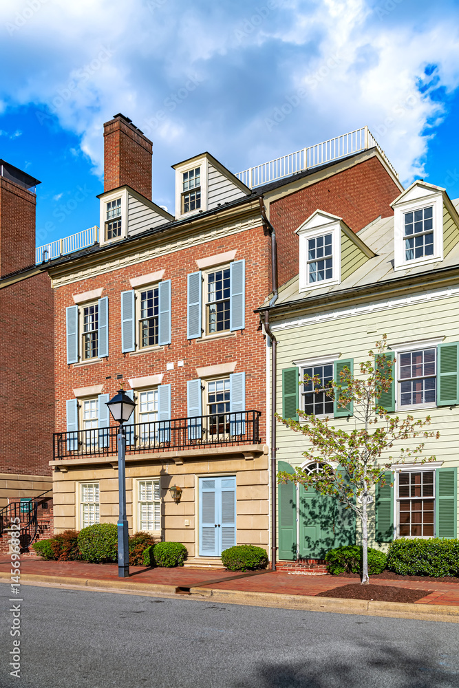 Fototapeta premium street with modern brick townhouses lining the road.