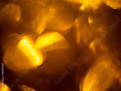 Obraz na płótnie Abstract bokeh background with warm color. Digital background for design. Lens flare and light glow. Visual effect. w salonie