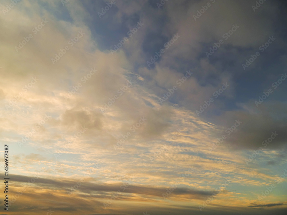 Blue cloudy sky, nature background for design. Clouds have random shape and form.